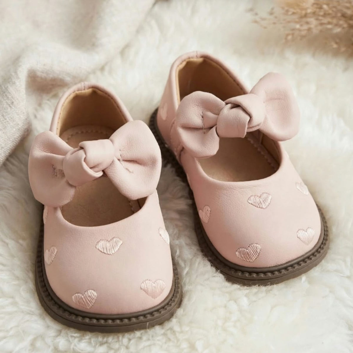 Smile Baby light pink baby girl shoes with large bow and heart embroidery product view
