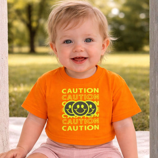 Smile Baby Kids “CAUTION Smiley” Graphic T-Shirt – Cream & Orange | 18 Months to 6 Years