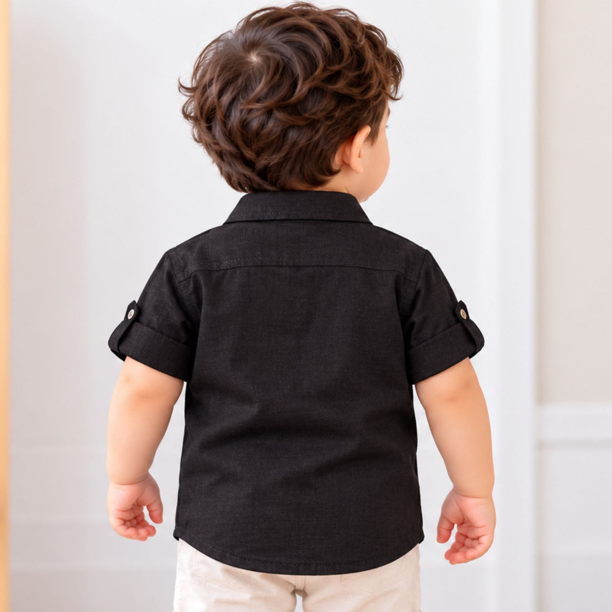 Back view of GUSTO black baby boys short sleeve shirt