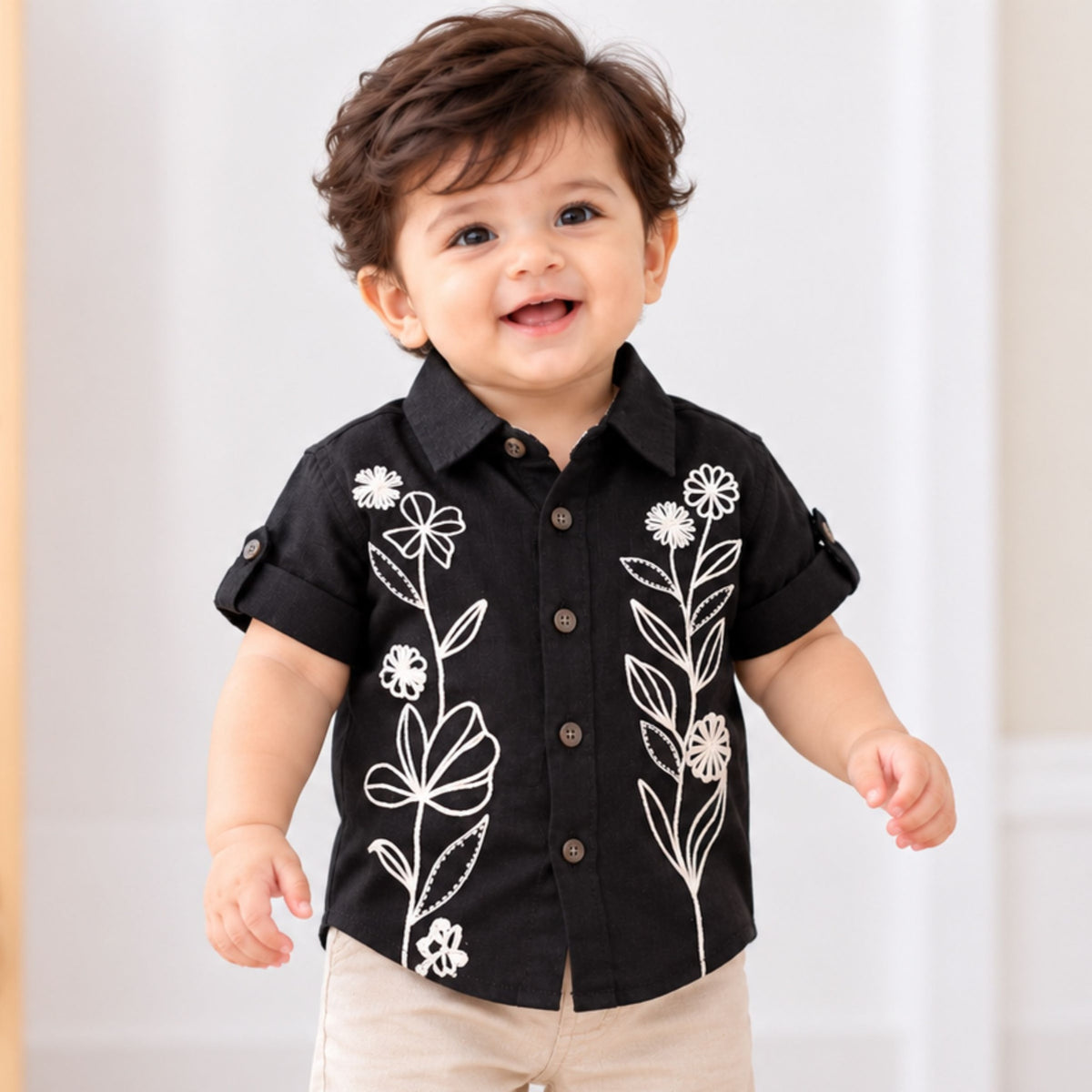 GUSTO black baby boys shirt with white floral embroidery, front view