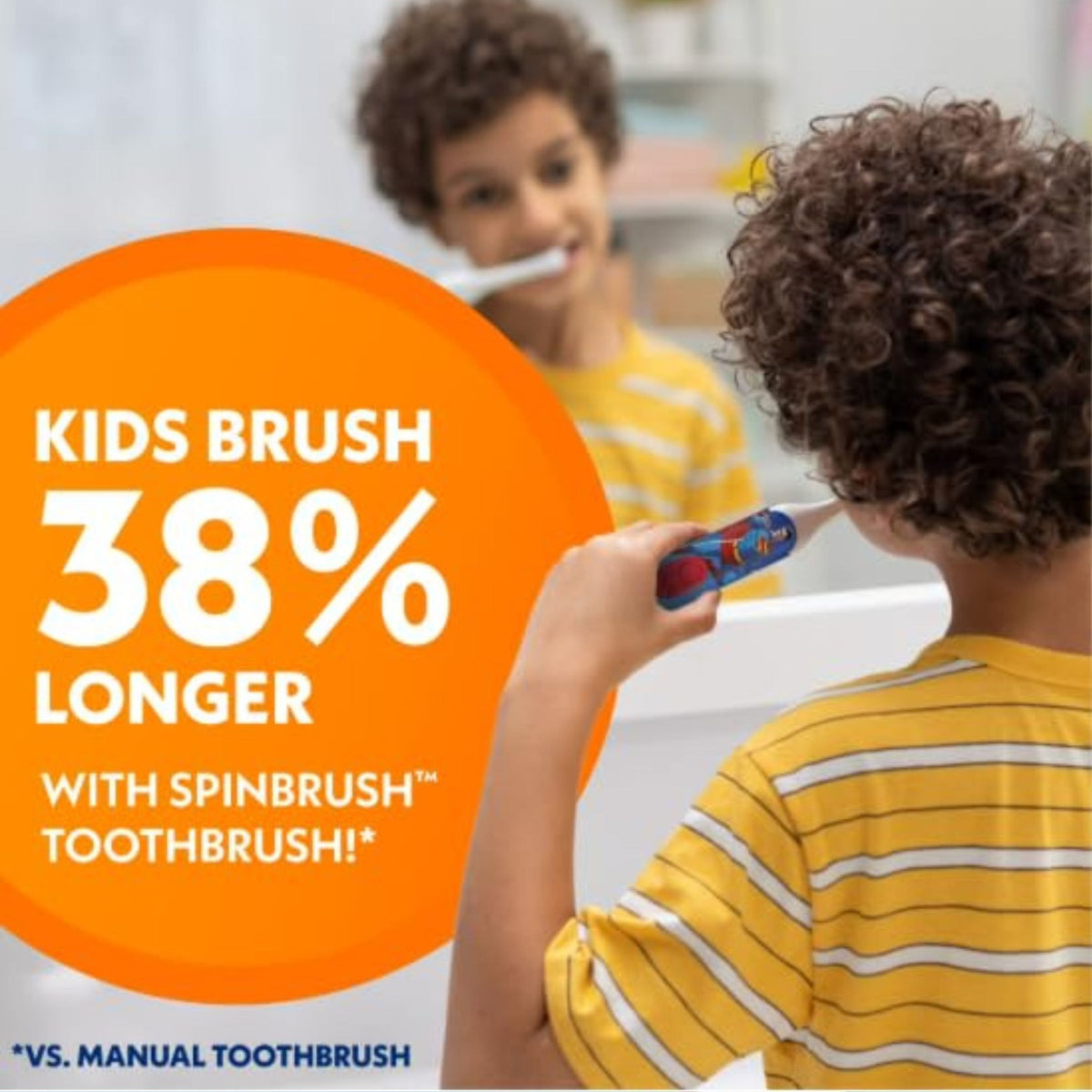 Child using Superman Spinbrush powered toothbrush