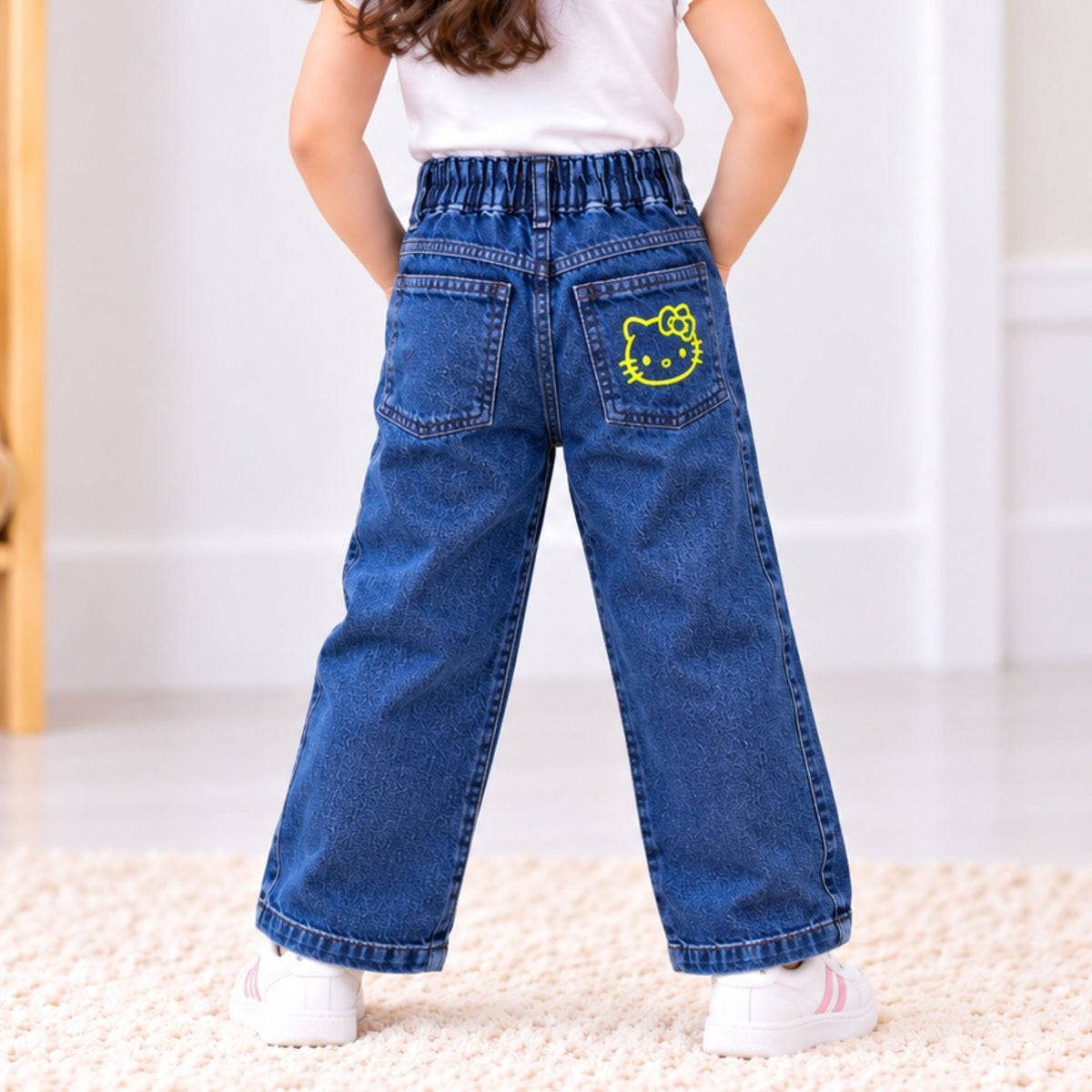 ROXY girls blue denim jeans back view with elastic waistband and yellow character patch on rear pocket