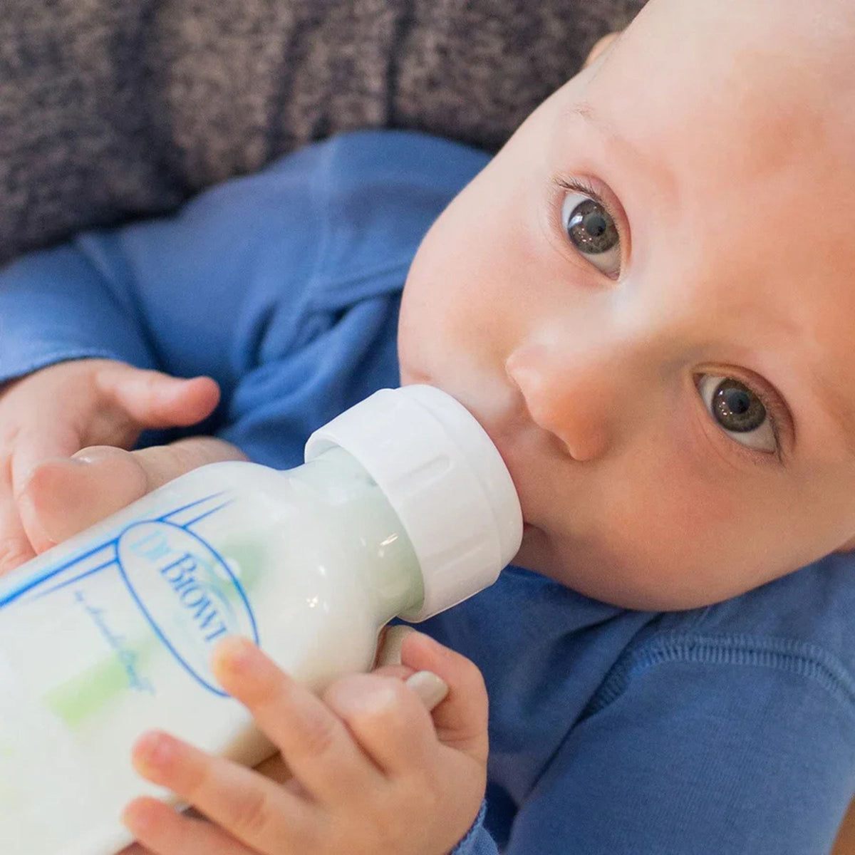 Dr. Brown's Natural Flow Anti-Colic Options+ baby bottle being used for infant feeding