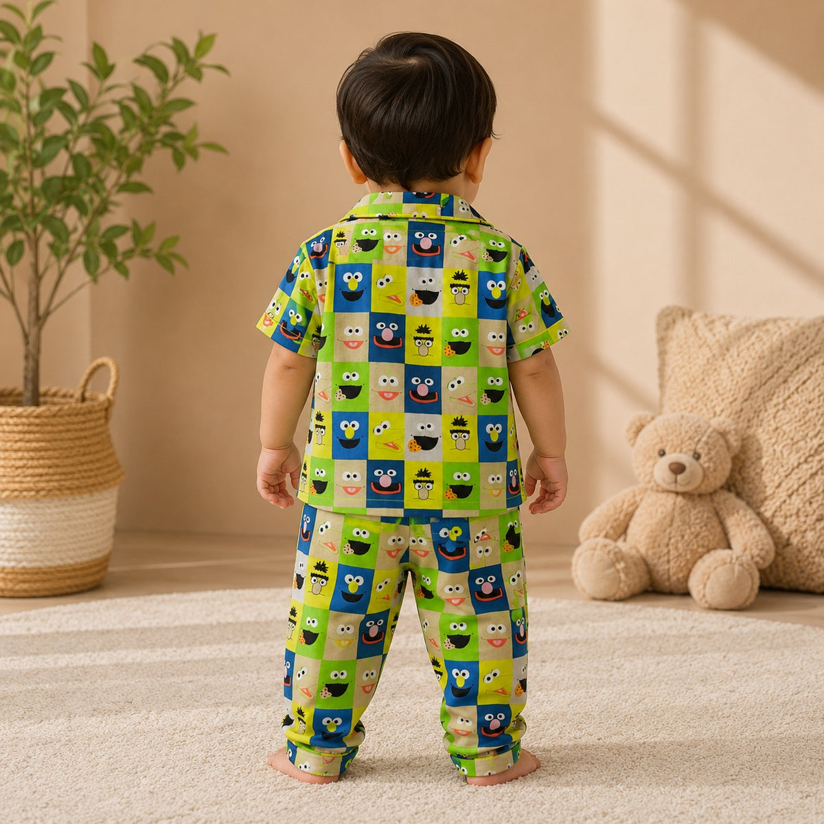 Back view of Smile Baby boys green cotton night suit featuring cartoon character check print