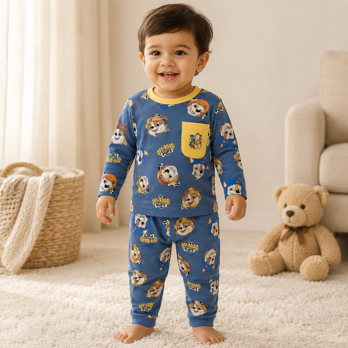 Cute little boy wearing Smile Baby powder blue full sleeve cotton night suit with puppy print, front view.