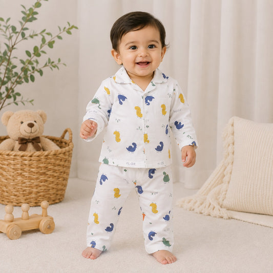 NUM NUM boys cream dinosaur printed pajama set front view with collared full-sleeve top and matching pants