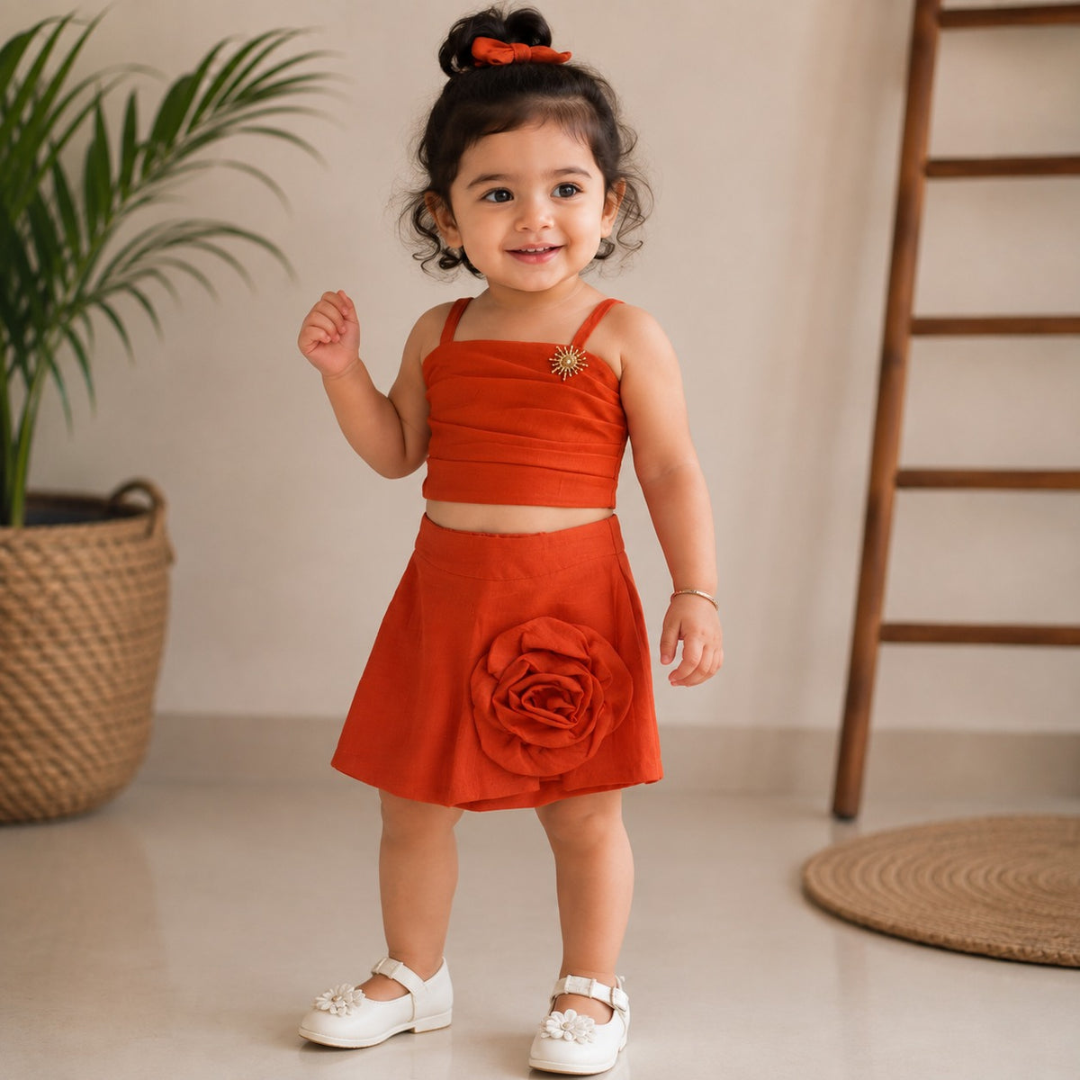 ROXY girls Orange top and skirt set front view with pleated top and 3D flower skirt detail