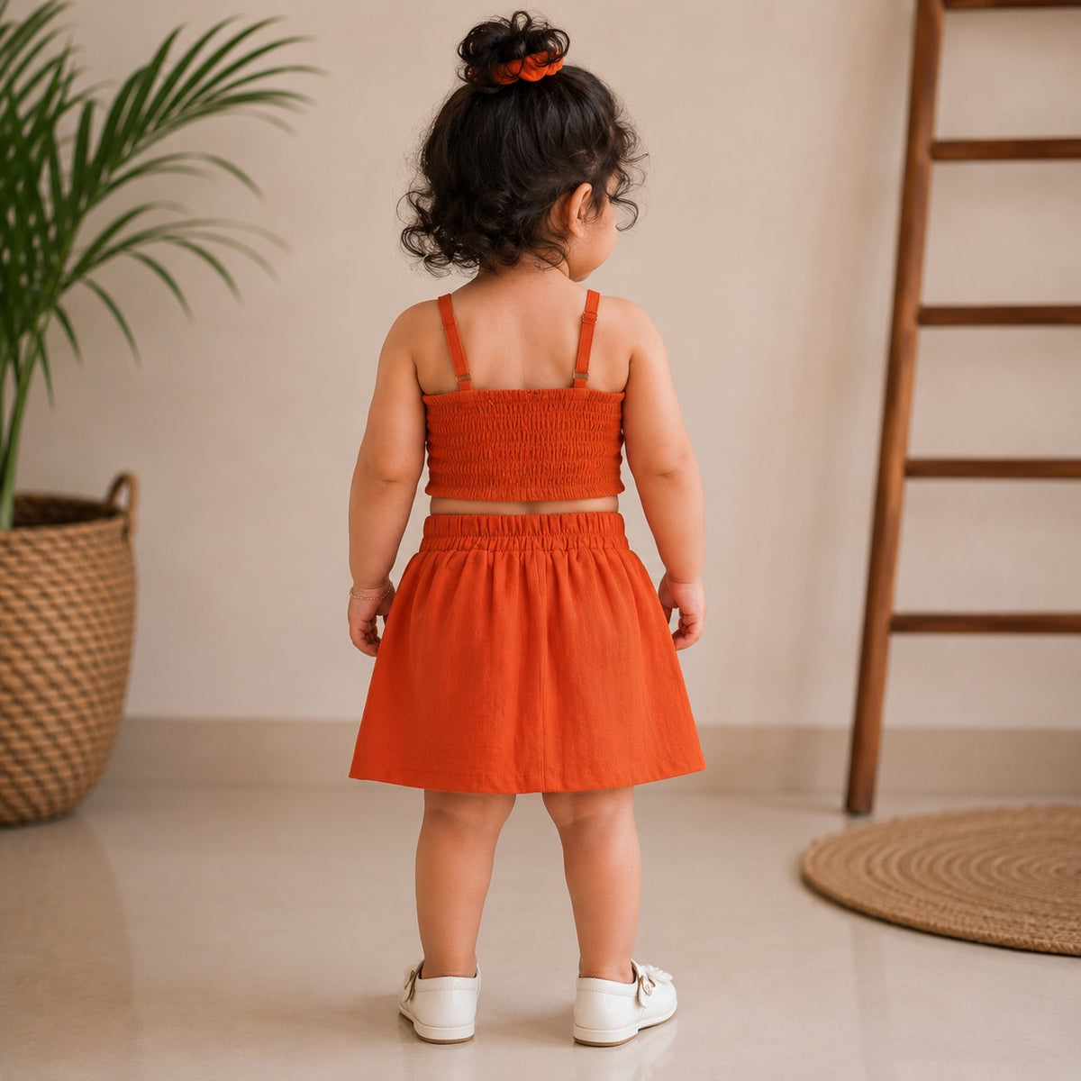 ROXY girls Orange top and skirt set back view with smocked back and elastic skirt waist