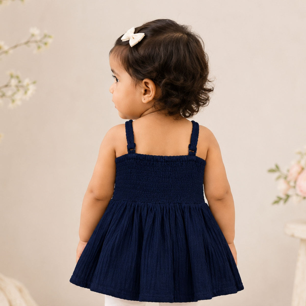 REVERSE X-TREME girls dark blue sleeveless feather embroidered top back view with smocked elastic bodice