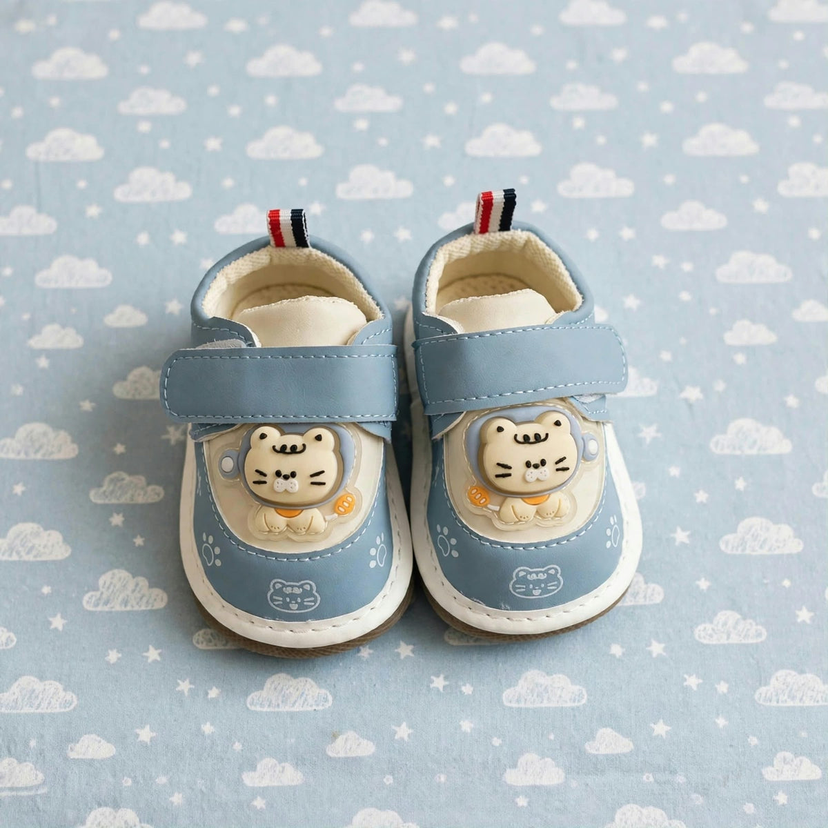 Smile Baby blue baby cat squeaker shoes front view with adjustable Velcro strap