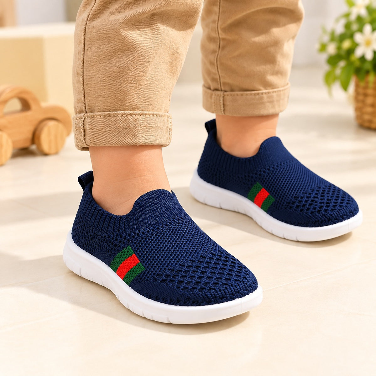 Smile Baby boys navy lightweight knit slip-on shoes worn by child
