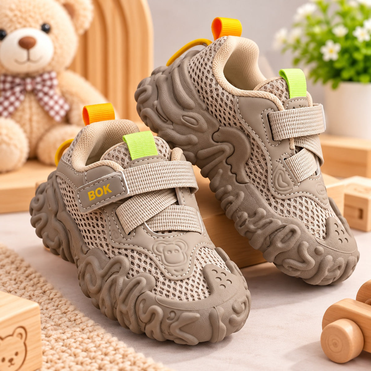 Pair of Smile Baby beige boys toddler sneakers with chunky textured soles and bright pull tabs