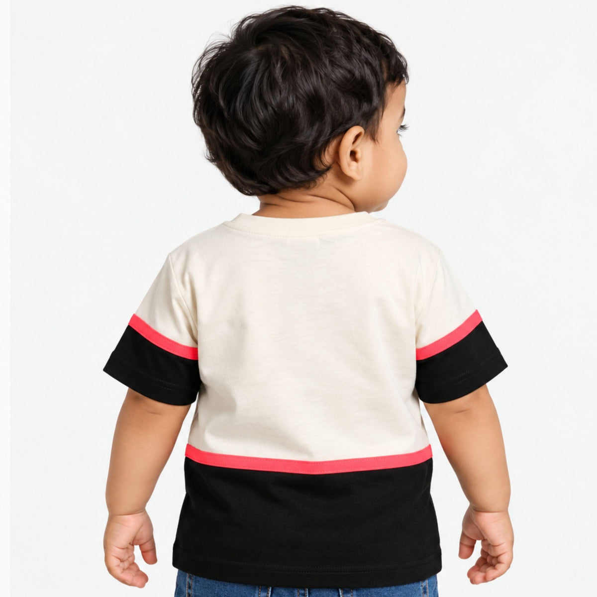 Back view of COOLEST toddler boys cream T-shirt with black color-block sleeves and hem with coral trim