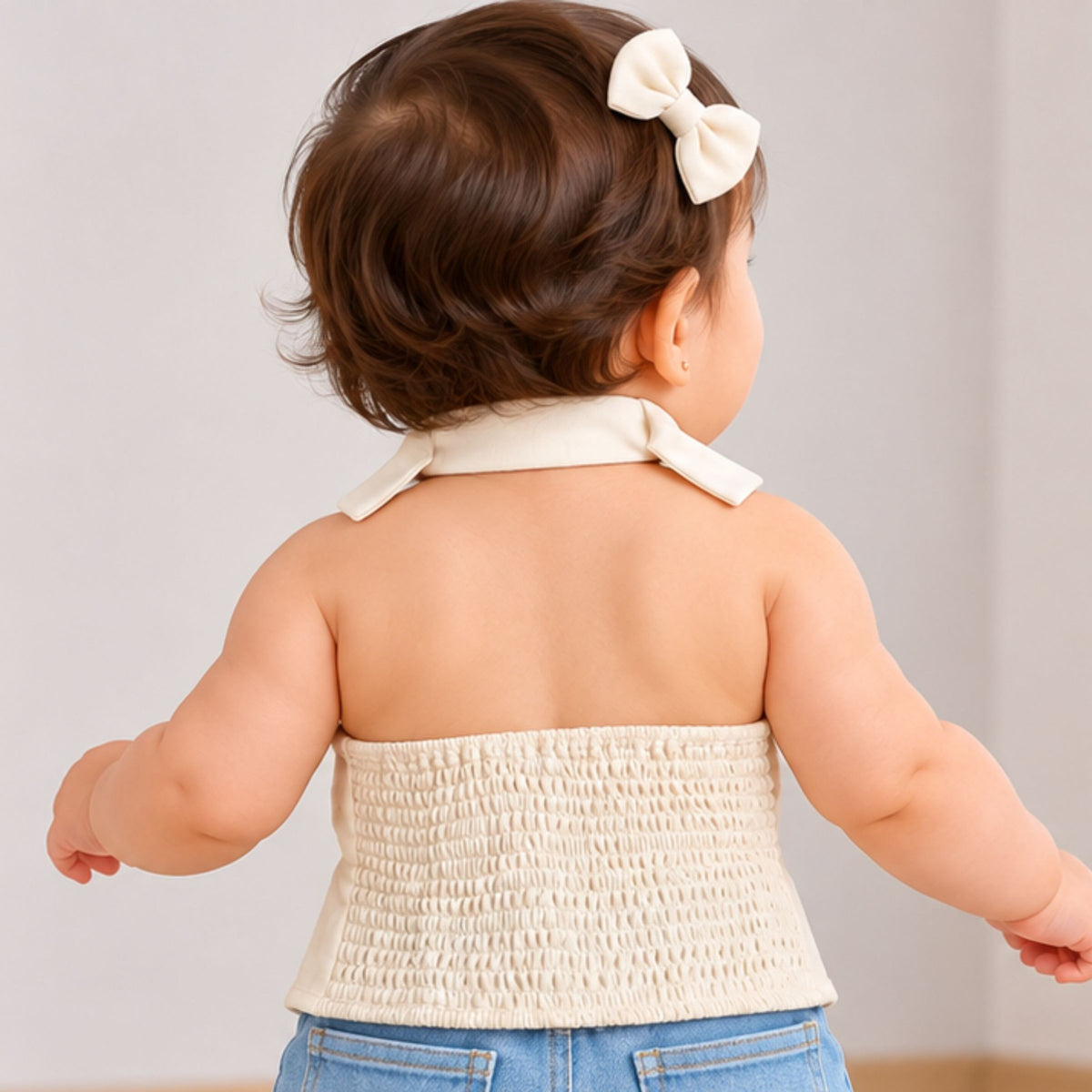 Back view of REVERSE X-TREME white girls top showing smocked panel