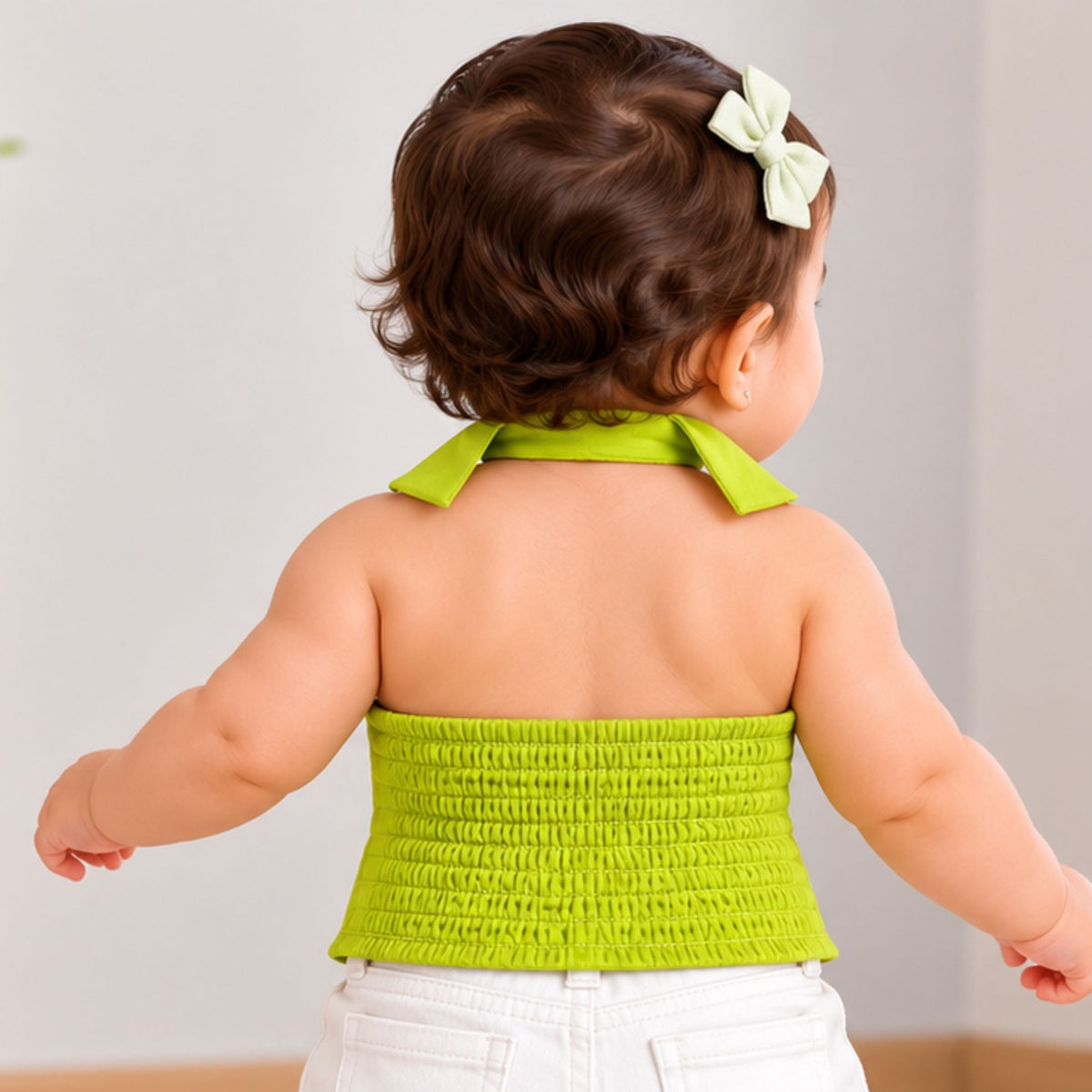 Back view of REVERSE X-TREME neon green girls top showing smocked panel