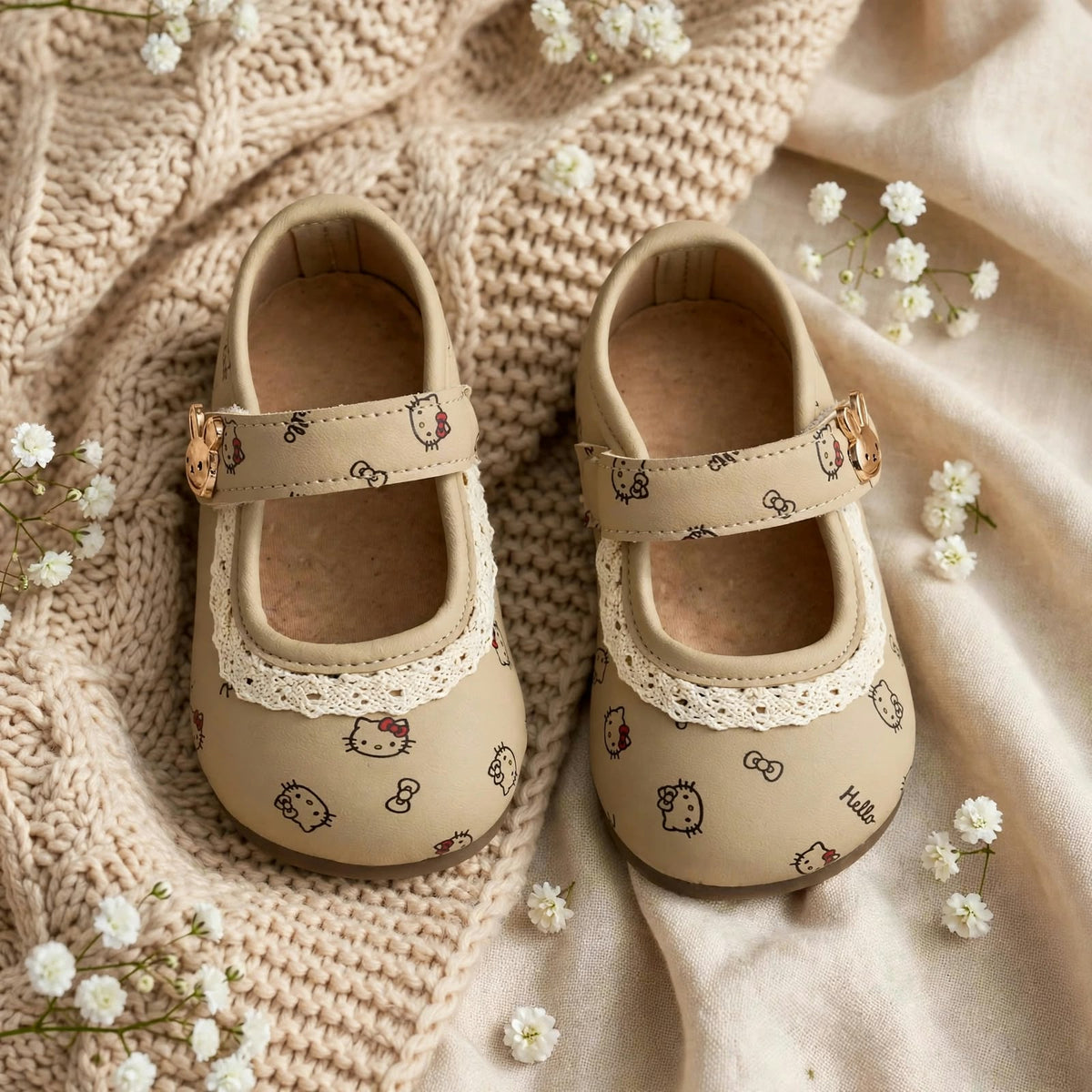 Smile Baby beige Hello Kitty baby girl shoes front pair view with lace detail