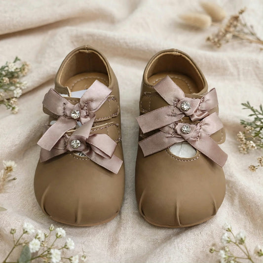 Smile Baby brown baby girl bow shoes close up with comfortable soft lining